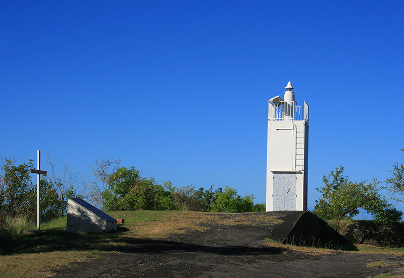Lighthouse at Pointe de l'Anse. Nearby was erected a stele in memory of the victims of the public transport accident