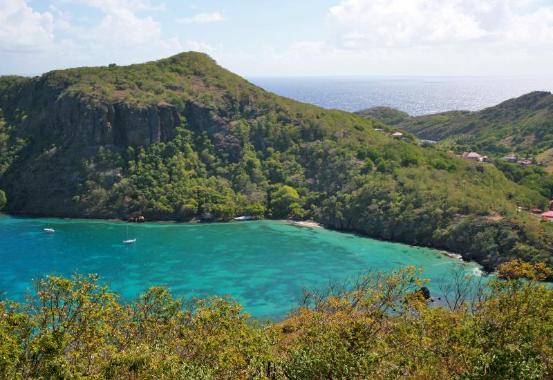 The bay with turquoise waters dominated by Morne Morel