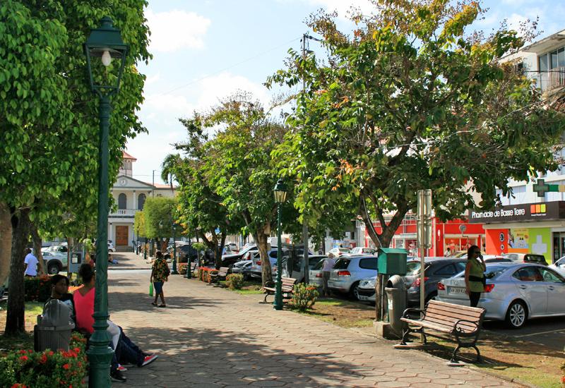 Cours Nolivos - Basse-Terre. Facing the shady square, many shops