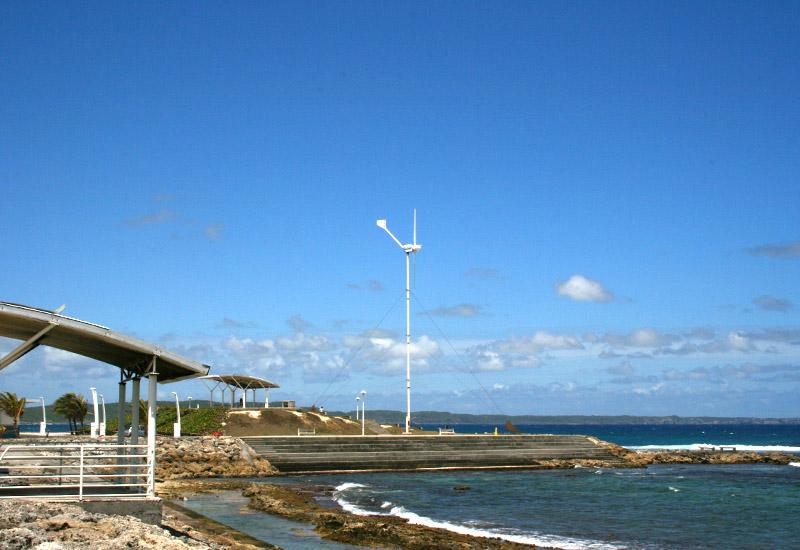 A wind turbine supplies energy to the lights