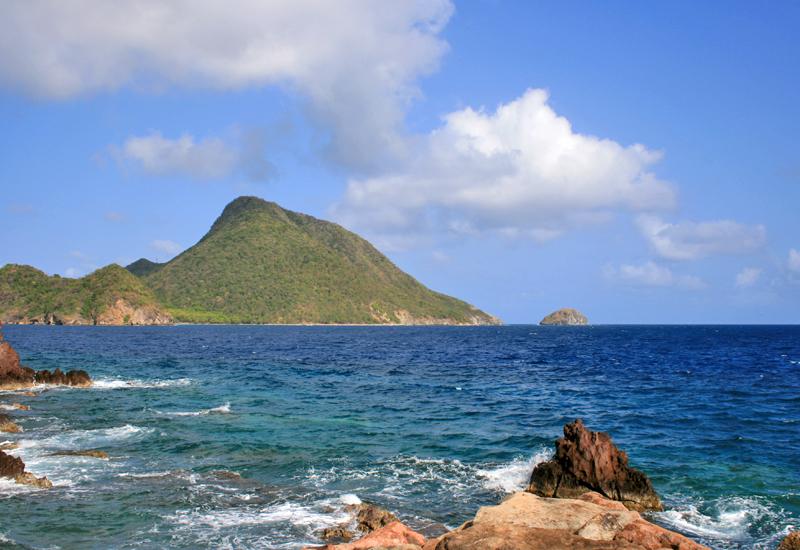 Terre-de-Bas, Anse des Mûriers. View of Le Chameau mountain and the Redonde island