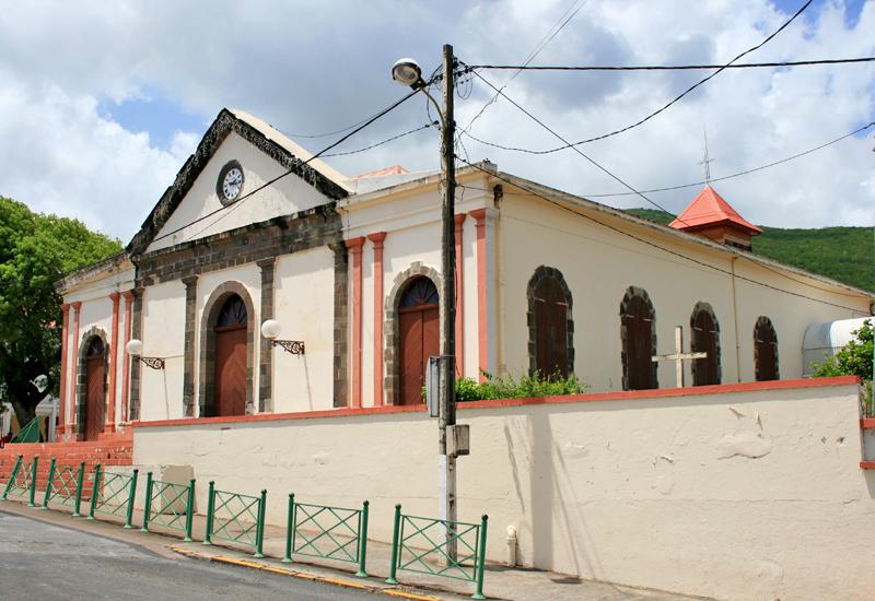 Pointe-Noire, Guadeloupe. Notre Dame de l'Assomption, neo-classical pediment highlighted by a volcanic stone link